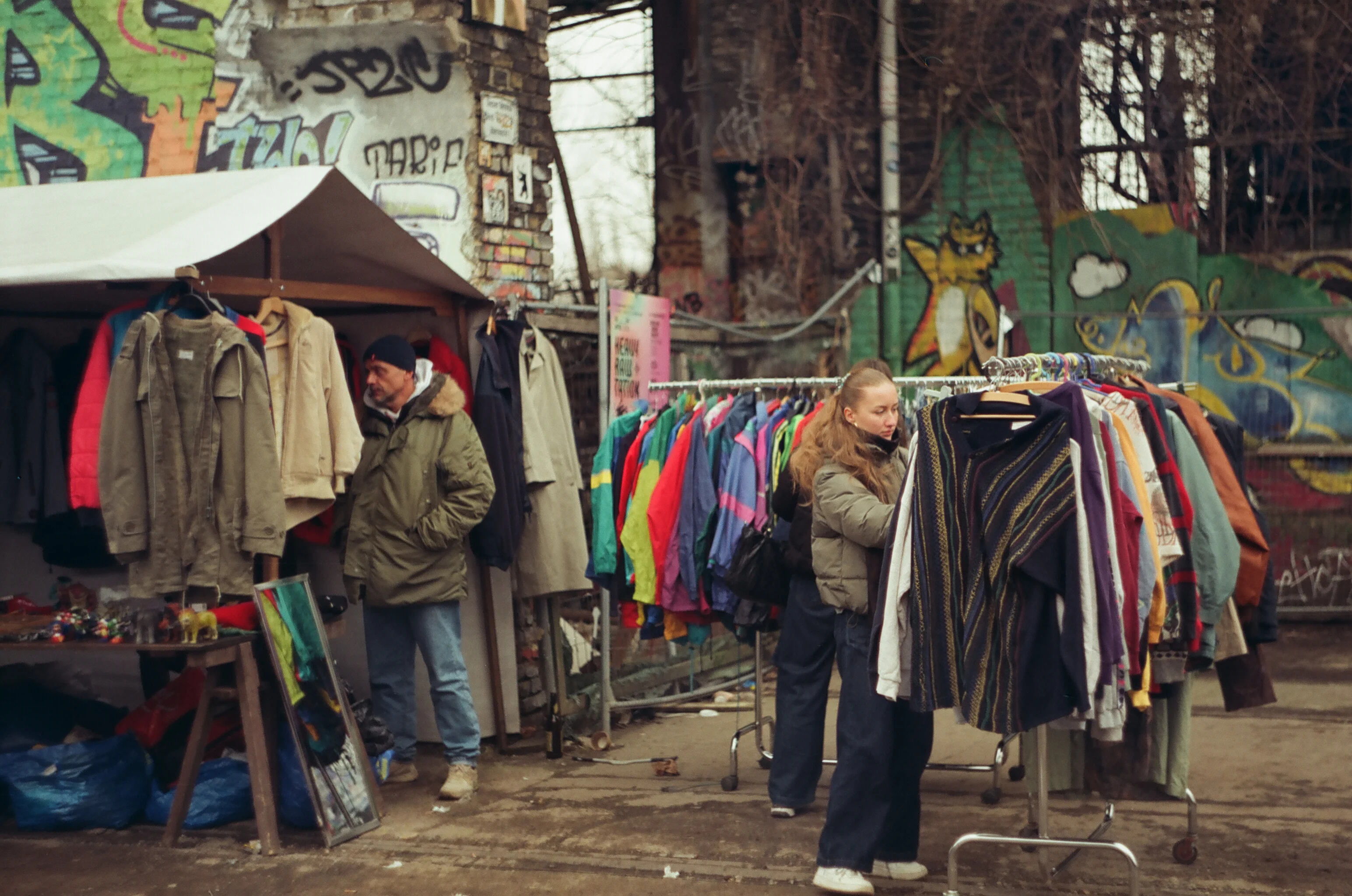 People looking at clothes at a flea market